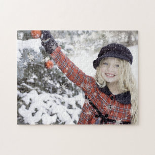 Puzzle Happy girl decorating Christmas tree