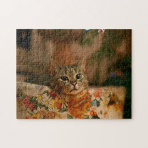 Puzzle Kitten peeking behind the Christmas tree