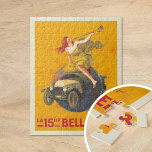 Puzzle La Bellanger 15ch | Leonetto Cappiello<br><div class="desc">La 15ch Bellanger (1921) | L’affiche publicitaire 1921 de Leonetto Cappiello pour La 15ch Bellanger attire l’attention avec un design audacieux et imaginatif. Il présente une femme en robe jaune flottante assise sur un globe, soufflant une corne pour annoncer l'arrivée d'une voiture Bellanger, qui explose dramatiquement à travers le globe....</div>