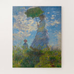 Puzzle La femme de Monet avec parasol<br><div class="desc">Une femme au parasol a été peinte par le peintre impressionniste Claude Monet en 1875. Le tableau est de Madame Monet et de son fils. Ce chef-d'oeuvre classique est rempli de lumière et de douceur dans les tons pastel et lumineux de bleu et vert.</div>