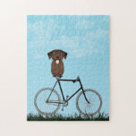 Puzzle Labrador Retriever Dog assis sur une bicyclette Vi<br><div class="desc">Puzzle avec un adorable Labrador au chocolat assis sur une bicyclette à l'ancienne,  un jour d'été bleu.</div>