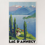 Puzzle Lac paisible Annecy Vintage France Affiche de voya<br><div class="desc">Une reproduction Art déco de qualité présente le paysage paisible du lac d'Annecy, dans la région Rhône-Alpes, dans le sud-est de la France. Redessiné et restauré numériquement à la discrétion de l'artiste. Nos puzzles sont fabriqués à partir de carton robuste et de panneaux agglomérés et sont imprimés dans des couleurs...</div>
