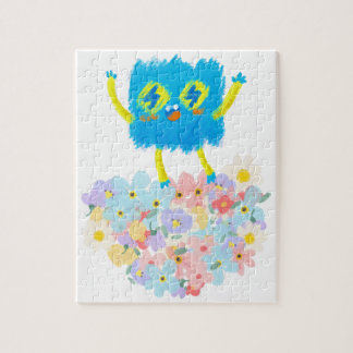 Puzzle Le Gribouillis Bleu Heureux sur un Lit de Fleurs