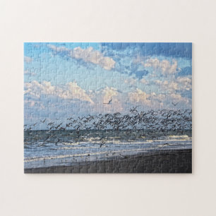 Puzzle Les amateurs de ski noir décolle sur la plage de C