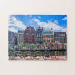 Puzzle Maisons à vélo le long du canal d'Amsterdam Pays-B<br><div class="desc">Ce somptueux puzzle sur le thème de la ville comporte des vélos le long du canal d'Amsterdam avec des bâtiments dans le arrière - plan. #amsterdam #jigsawpuzzle #cadeau #stockingstufferen</div>