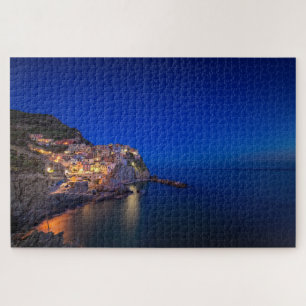 Puzzle Manarola town in the Cinque Terre in the evening