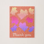 Puzzle Merci Leaf Motifs Feuilles orange rose<br><div class="desc">Imprimé avec des motifs colorés et artistiques en arrière - plan orange de feuilles d'automne avec le message "Merci" que vous pouvez personnaliser. Vous pouvez aussi choisir une couleur arrière - plan différente si vous le souhaitez !</div>