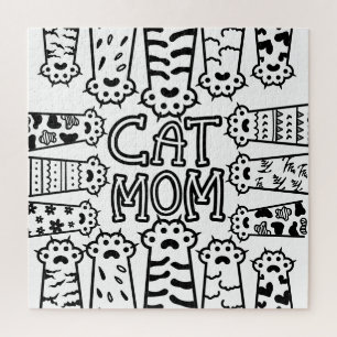 Puzzle Mignonne maman chat noir et blanc avec pattes de c