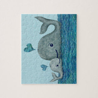 Puzzle Natation de maman et de bébé de baleine en mer