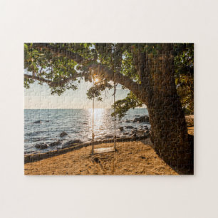 Puzzle Oscillation sur la plage au coucher du soleil