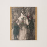 Puzzle Photo de Christmas Girls et Snowman Vintage<br><div class="desc">A charming antique 1910 French Christmas photo postcard of two pretty,  adorable little girls happily hugging and posing with their solive snowman friend,  as snow flow down upon them. Wishing a Joyeux Noel.</div>
