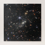 Puzzle Première vue profonde de l'univers de Webb<br><div class="desc">Vaste et profonde, cette image capture une minuscule tranche du début de l'univers, grouillant de milliers de galaxies de formes et de tailles diverses. Les couleurs pâles des galaxies témoignent de leur immense distance, certaines datant de 13, 8 milliards d'années. Les galaxies spirales, comme notre propre Voie Lactée, serrent de...</div>