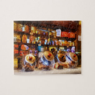 Puzzle Quatre pots de bonbons en verre