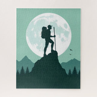 Puzzle Randonneur en silhouette sur un pic avec la lune e