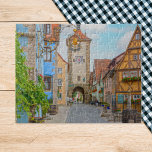 Puzzle Rothenburg ob der Tauber Ville médiévale Pittoresq<br><div class="desc">Entrez dans un monde de contes de fées avec ce superbe puzzle avec Rothenburg ob der Tauber, Allemagne. La ville médiévale pittoresque est réputée pour ses charmantes maisons à colombages, ses ruelles pavées étroites et son atmosphère romantique, le tout capturé avec un détail époustouflant dans cette photo prise le matin....</div>