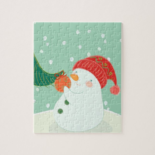 Puzzle Un bonhomme de neige accrochant un ornement sur un (Vertical)