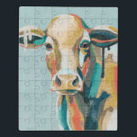 Puzzle Vache colorée<br><div class="desc">Cette impression colorée présente un portrait en orange et turquoise | Par Grace Popp</div>