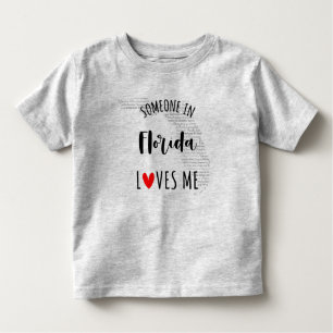 Quelqu'Un En Floride M'Aime Carte Baby T-shirt