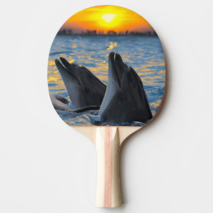 Raquette De Ping Pong Les dauphins bouteille-flairés dans la lumière d