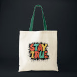 Restez Sac fourre-tout - Authenticité et individua<br><div class="desc">Faites une déclaration avec ce sac fourre-tout unique avec l'expression habilitante 'RESTER VRAI' en caractères gras et colorés. Parfait pour un usage quotidien, pour faire du shopping ou comme cadeau pour les amis et la famille qui apprécient l'authenticité et l'individualité. Fabriqué à partir de matériaux de haute qualité, ce sac...</div>
