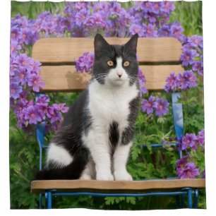 Rideaux De Douche Tuxedo cat sitting on a garchair with flowers