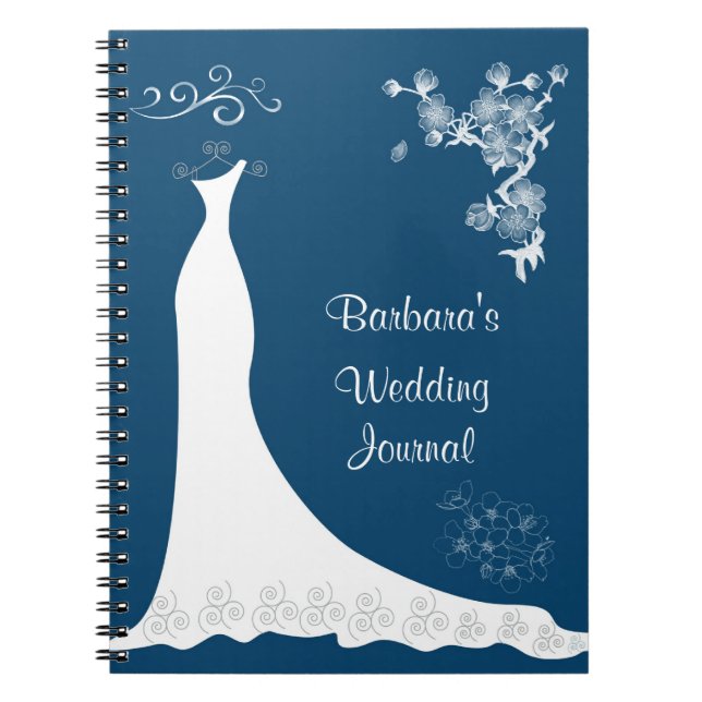 Robe blanche sur le carnet bleu de wedding planner (Devant)