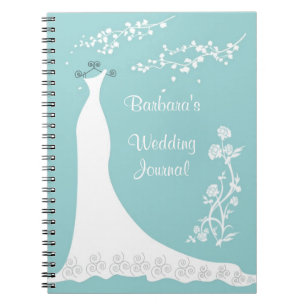 Robe blanche sur le carnet de wedding planner