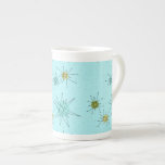 Robin's Oeuf Blue Starbursts China Mug<br><div class="desc">Le motif de ce Robin's Oeuf Blue Iconic Atomic Starbursts Bone China Mug comporte des étoiles atomiques emblématiques. C'est vrai ! L’ancienne école, arrière - plan de couleur bleu oeuf de robin avec des taches d’or, est la toile de fond idéale pour les cercles turquoise, apaisants et vert poire kitsch....</div>