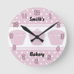 Ronde Horloge rose de boulangerie de petit gâteau