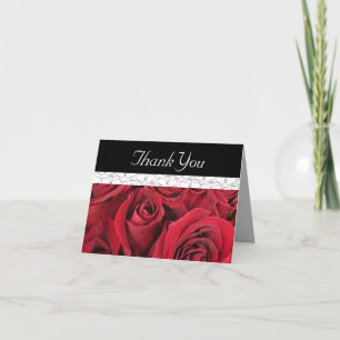 Roses rouges et carte de remerciements de coeurs