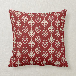 Rouge et coussin décoratif de motif de crème