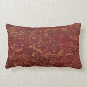 Rouge et vieux coussin de regard de damassé d'or