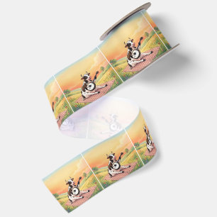 Ruban En Satin Vache jouant du banjo sur une couverture