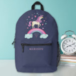 Sac À Dos Imprimé Cute Girl Magique arc-en-ciel Unicorn<br><div class="desc">Une mignonne licorne magique aux coeurs et un arc-en-ciel décorent ce sac à dos. Personnalisez-le avec son nom. Donc amusant pour le retour à l'école1 Conçu pour vous par Blackberry Boulevard.</div>