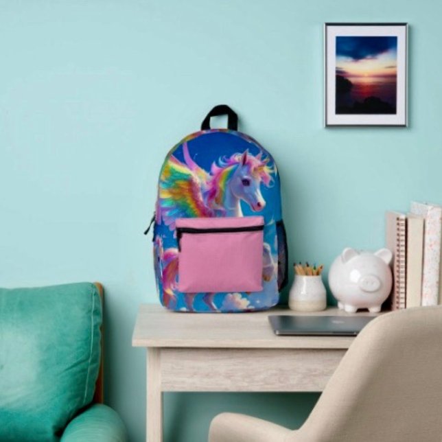 Sac À Dos Imprimé Licorne arc-en-ciel ailée dansante  (Backpack – D: 17"x12.5"x5" Two-chamber design with laptop storage pouch. Mesh side pocket.
)