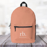 Sac À Dos Imprimé Monogramme Corail Pêche Élégante Feminine Minimali<br><div class="desc">Un design minimaliste monogramme avec de grandes initiales typographiques dans une police classique avec votre nom ci-dessous sur un arrière - plan de pêche au corail féminin. Le cadeau ou accessoire parfaitement personnalisé !</div>