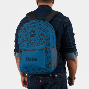 Sac À Dos Imprimé Pattes de chien noir et blanc à pois sur fond bleu
