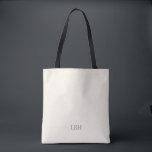 Sac à main monochrome minimaliste pour demoiselle<br><div class="desc">Un cadeau qu'elles emporteront partout— littéralement. Ce sac à main ivoire avec un monogramme gris épuré est suffisamment spacieux pour les essentiels du jour du mariage et suffisamment chic pour les courses quotidiennes. Un cadeau personnalisé pour demoiselle d'honneur qui est aussi pratique que beau.</div>