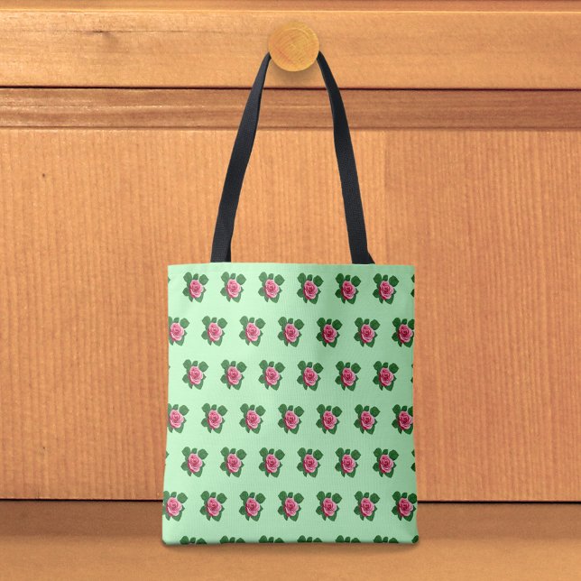 Sac à main vert clair avec motif sans couture de r (Light green tote bag with seamless pattern of a pink rose)