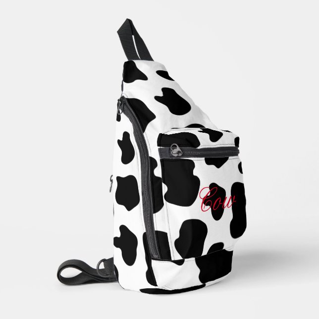 Sac à roulettes à taches de vache noires et blanch (Coin gauche)
