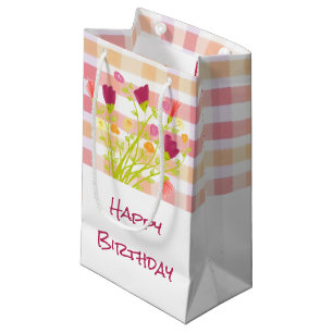 Sac cadeau en petit papier joliment plaqué et fleu