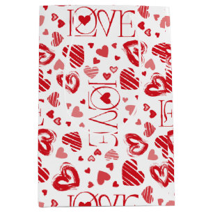 Sac cadeau moyen blanc avec coeurs rouges