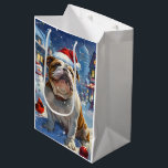 Sac Cadeau Moyen English Bulldog Winter Wonderland Christmas Joie<br><div class="desc">Ce design festif reflète l'esprit joyeux de la période des fêtes, avec un adorable petit portant un chapeau de Père Noël. Le chien est niché dans un pays des merveilles hivernales, avec un bonhomme de neige, un sapin de Noël décoré et des cadeaux joliment emballés. Les flocons de neige tombent...</div>