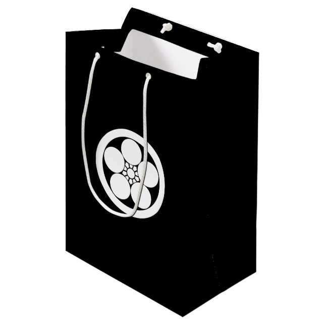 Sac Cadeau Moyen rond avec emblème de prune (Devant Angle)