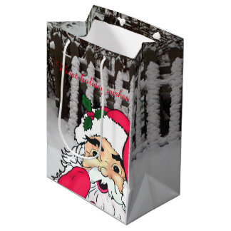 Sac Cadeau Moyen Santa Claus personnalisé sur une clôture de piquet