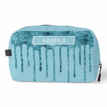Sac de toilette bleu sarcelle pailleté sur fond bl