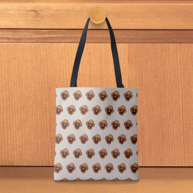 Sac fourre-tout à motif sans couture de pensée mar (Tote bag with seamless pattern of a brown pansy)
