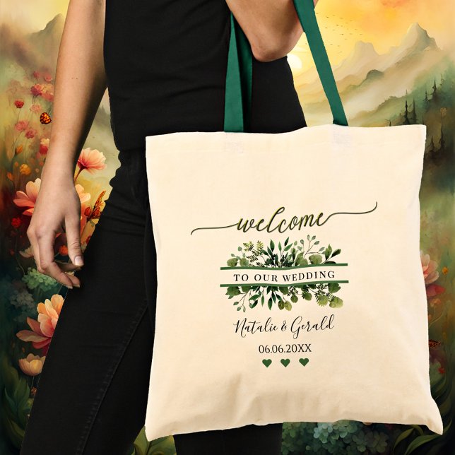 Sac fourre-tout de mariage à écriture de bienvenue (An elegant wedding tote bag featuring a stylized green welcome script text and greenery)