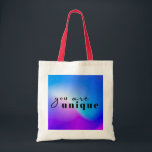 Sac fourre-tout unique - Célébrez l'individualité<br><div class="desc">Éloignez-vous de la foule avec ce sac fourre-tout accrocheur au design audacieux et coloré. Le message "vous êtes unique" est un rappel pour embrasser votre individualité et votre express vous-même avec confiance. Fabriqué avec des matériaux de haute qualité, ce sac est parfait pour l'usage quotidien, le shopping, ou comme cadeau...</div>