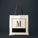 Sac noir et blanc élégant de monogramme<br><div class="desc">Si vous recherchez un sac de demoiselle d'honneur ou une idée personnalisée unique de cadeau de demoiselles d'honneur, ces petits sacs noirs et blancs élégants sont la réponse ! Le sac est disponible dans toutes les différentes tailles, et venu à un arrière-plan blanc avec un grand bloc noir de couleur...</div>